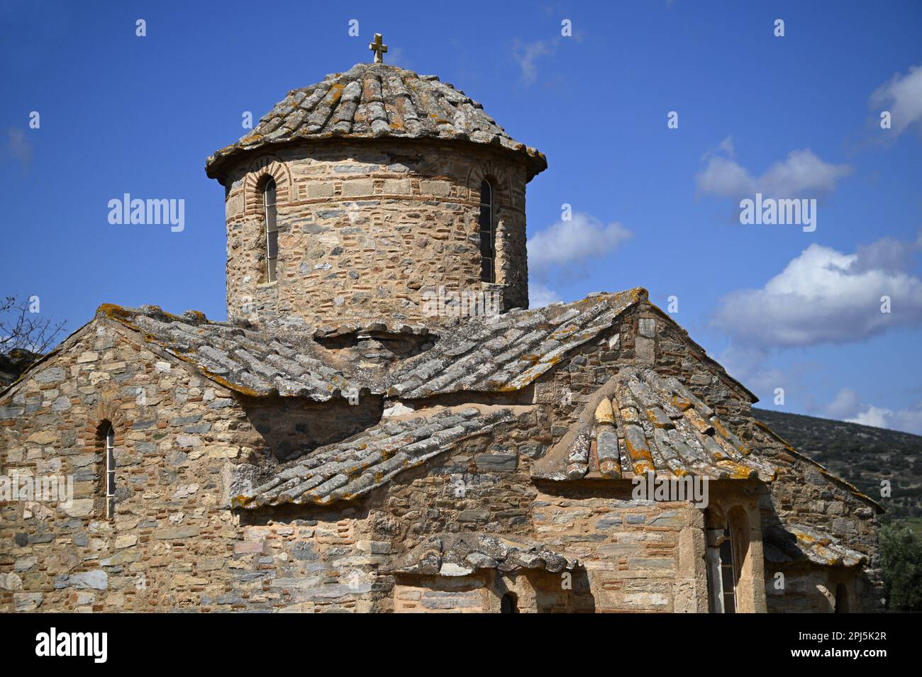 Landscape with scenic exterior view of Aghios Petros a 12th century rectangular cruciform Byzantine church in Kalyvia Thorikou, Attica Greece. Stock Photo