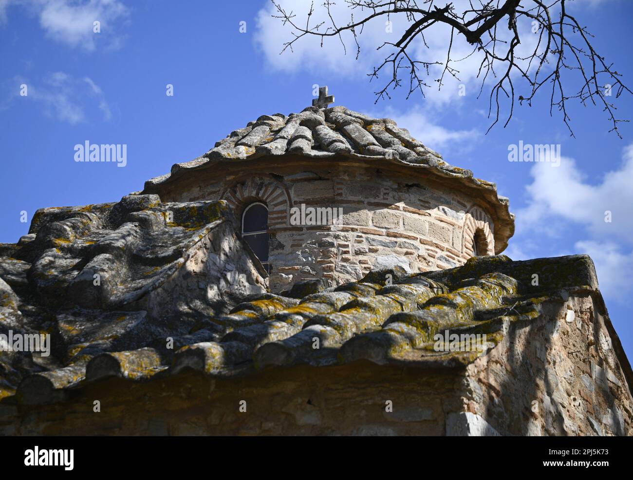 Landscape with scenic dome view of Aghios Petros a 12th century rectangular cruciform Byzantine church in Kalyvia Thorikou, Attica Greece. Stock Photo
