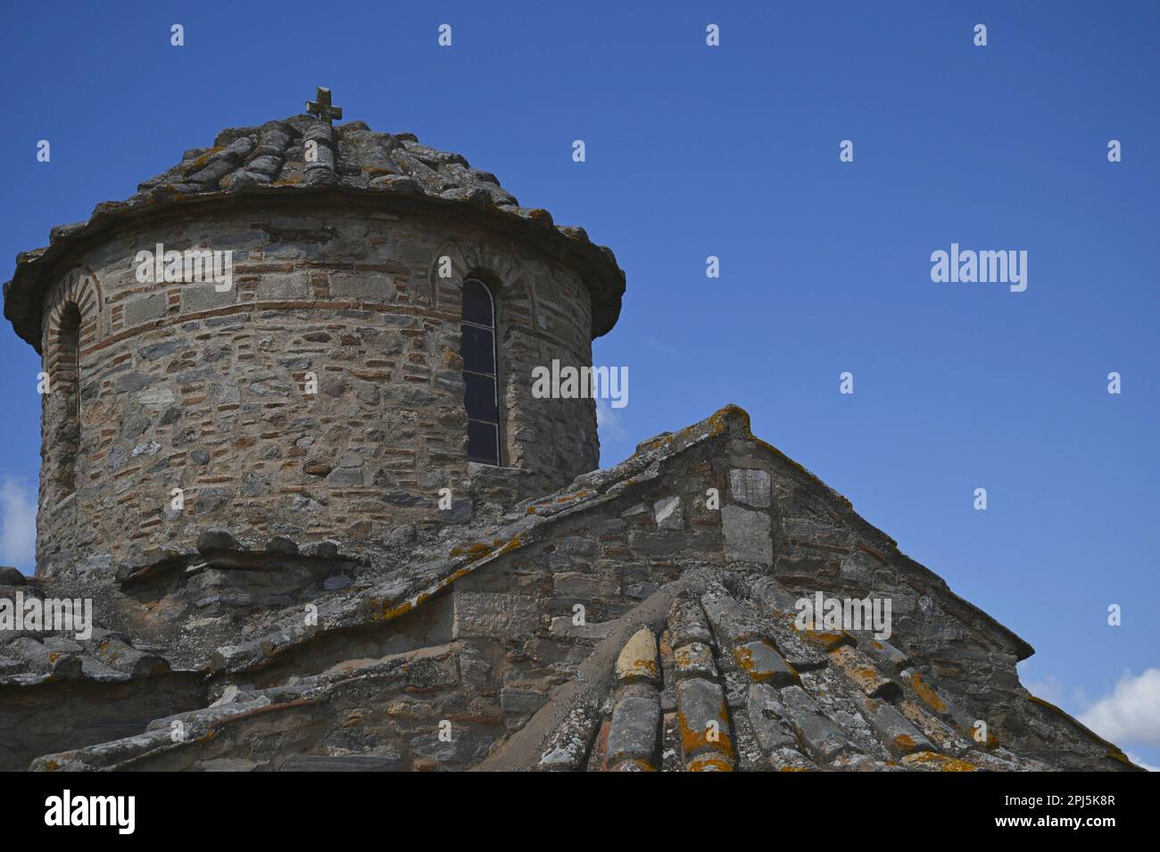 Landscape with scenic dome view of Aghios Petros a 12th century rectangular cruciform Byzantine church in Kalyvia Thorikou, Attica Greece. Stock Photo