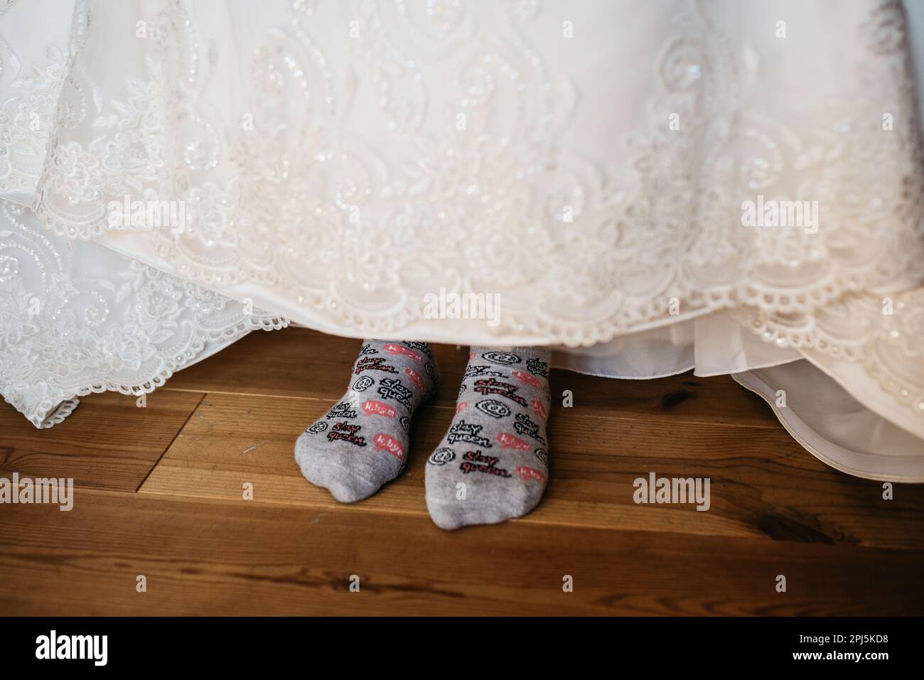 The bride wearing a funky pair of socks on her wedding Stock Photo Alamy