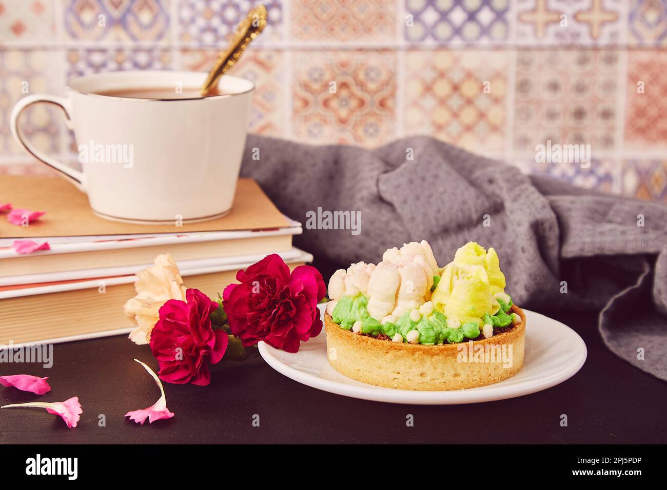 Hygge home aesthetic. Floral french tart with flowers. Desserts using