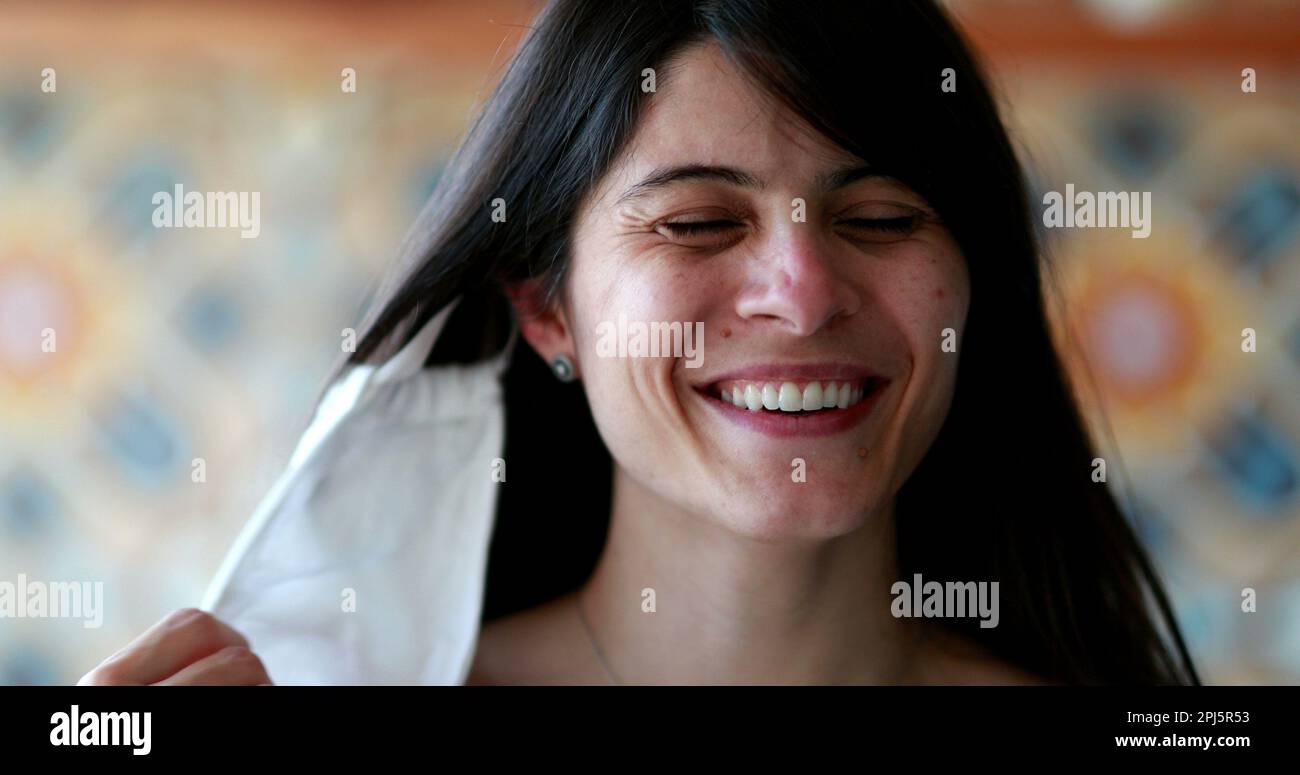 Face mask prevention falling off from woman face, girl blooper laughing out loud Stock Photo Alamy