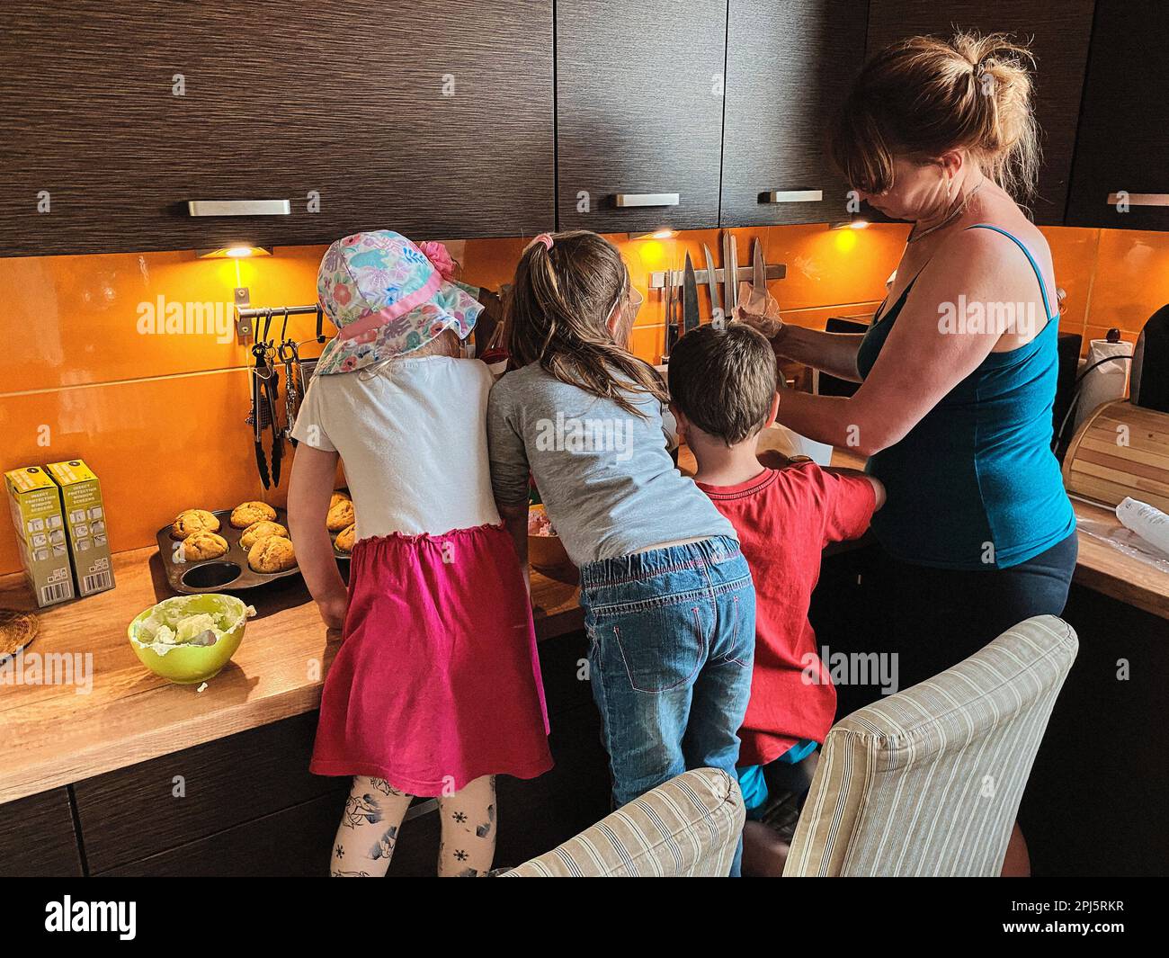 Group of children baking cupcakes, preparing ingredients, toppings ...