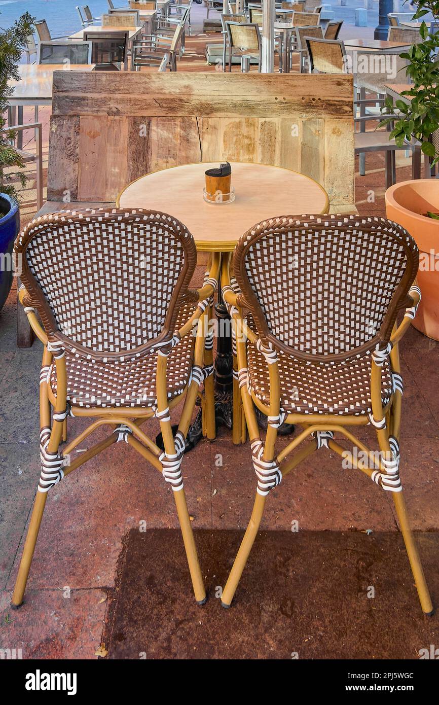 Wicker tables and chairs on the terrace of a cozy summer cafe overlooking the water in Turgutreis town Turkey Stock Photo Alamy