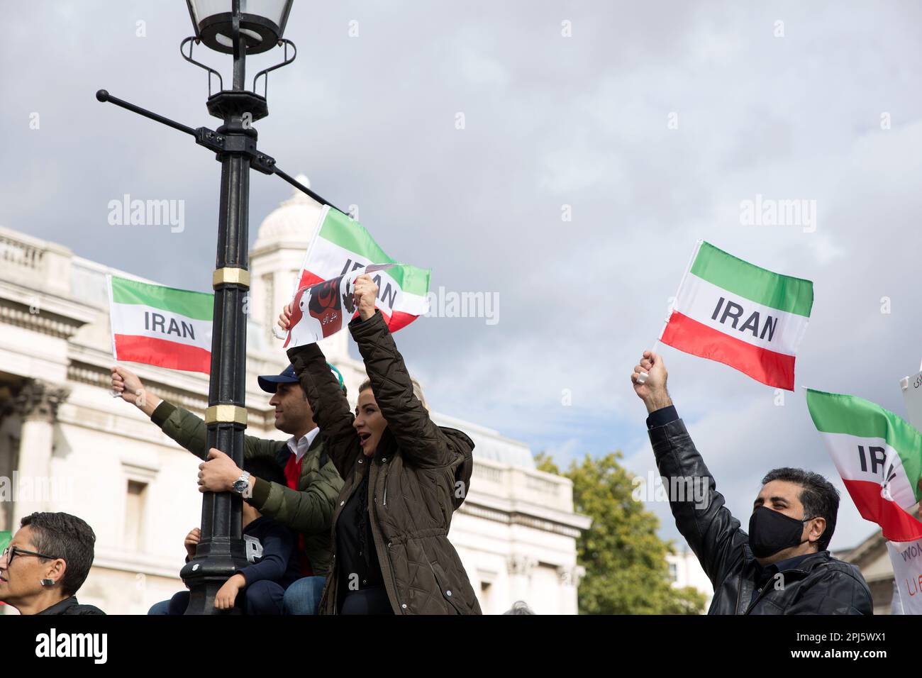 Posters, flags and messages are held as participants gather in support of freedom for women in Iran following the death of Mahsa Amini in London. Stock Photo