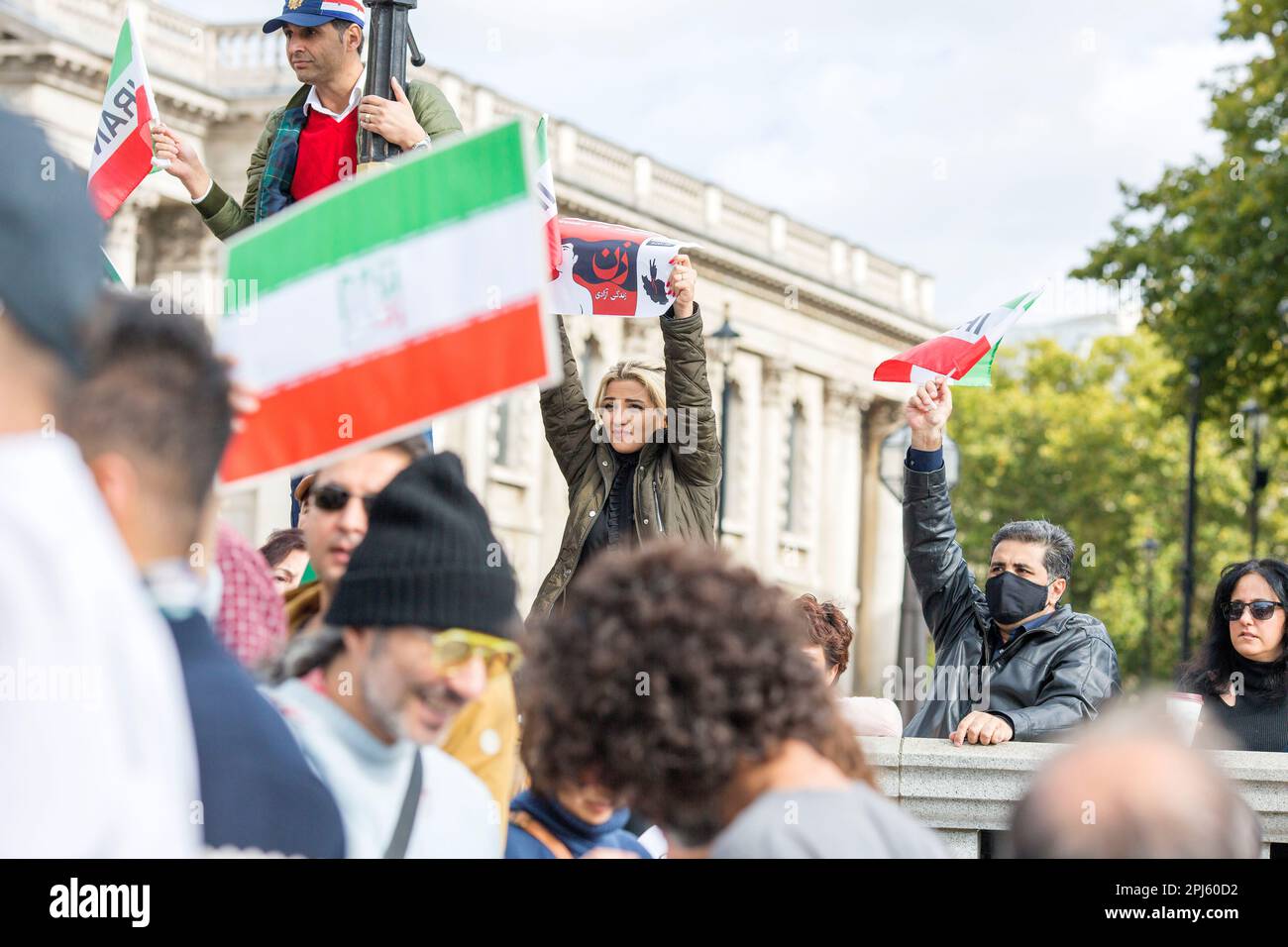 Posters, flags and messages are held as participants gather in support of freedom for women in Iran following the death of Mahsa Amini in London. Stock Photo