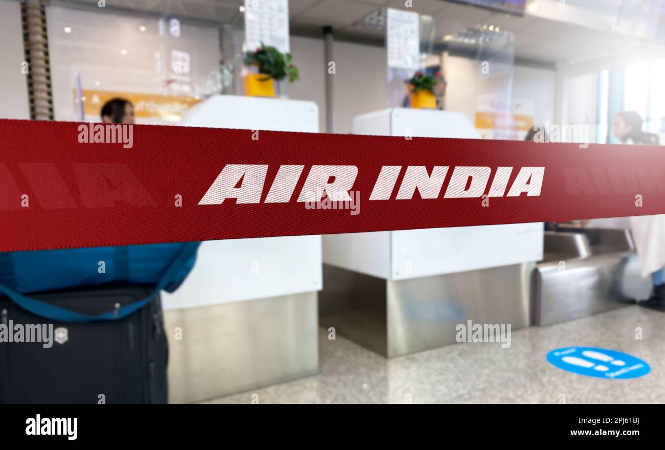 New Delhi, IN Jan 2023: Red barrier tape with Air India logo inside an airport. Air India is the flag carrier airline of India. Travel and airport sec Stock Photo
