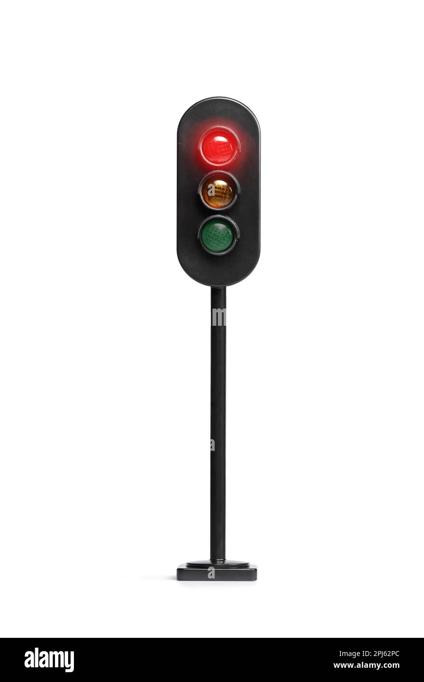 Studio shot of a traffic light with red light flashing isolated on white background Stock Photo
