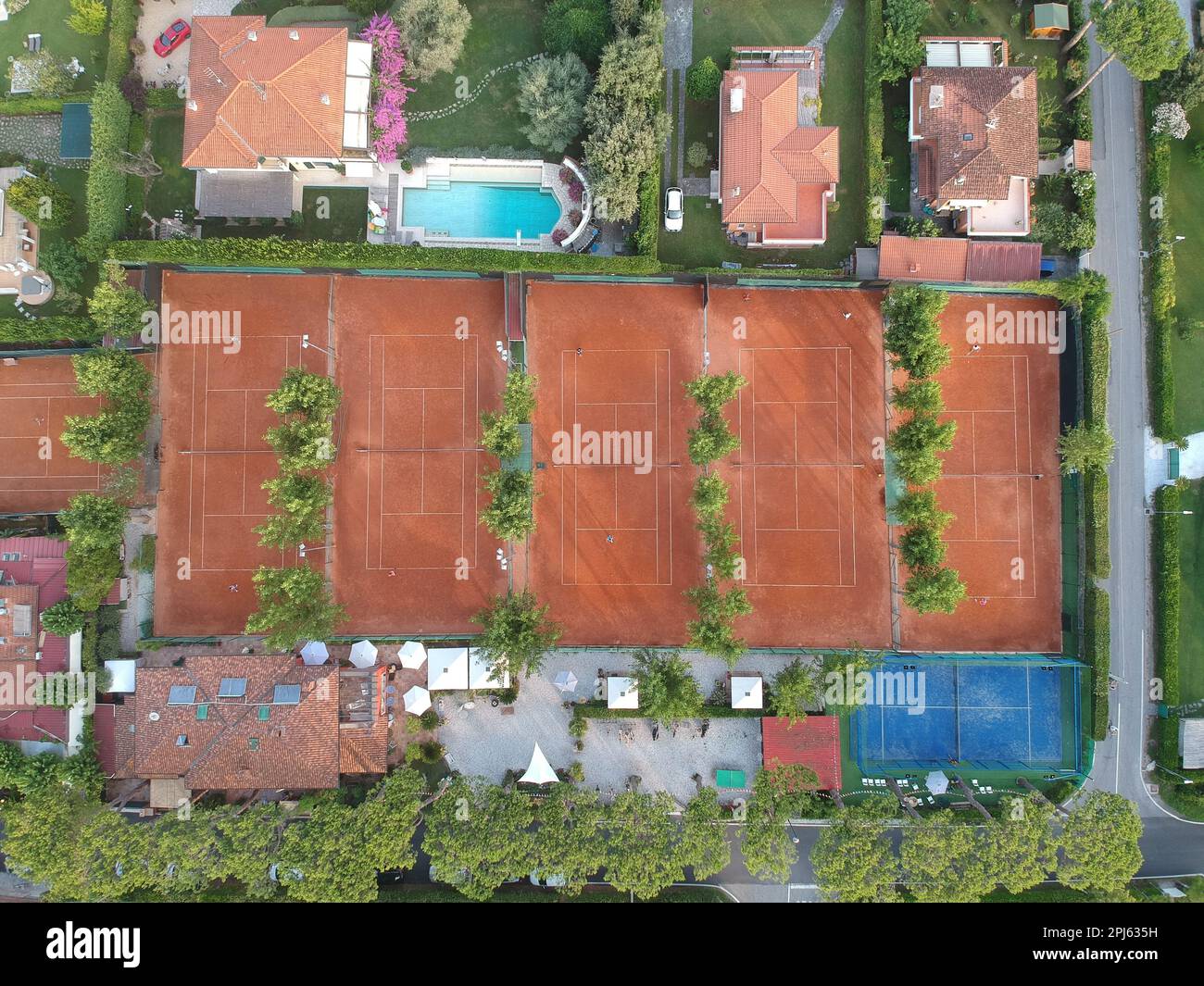 An aerial shot of a tennis court in the city of Toscana, Italy Stock Photo