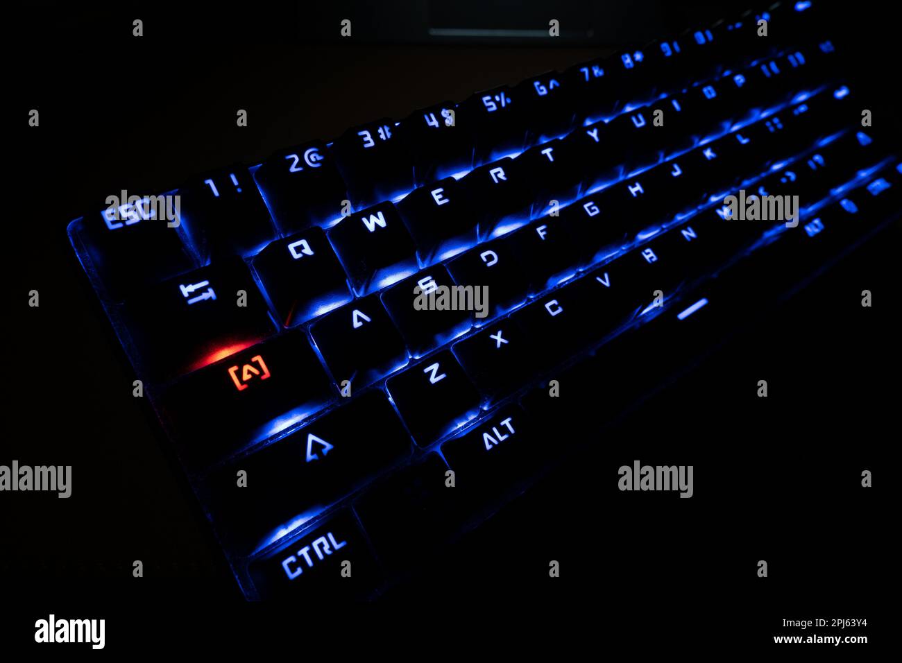 Illuminated RGB gaming backlit keyboard with Red Caps Lock Button Stock Photo Alamy