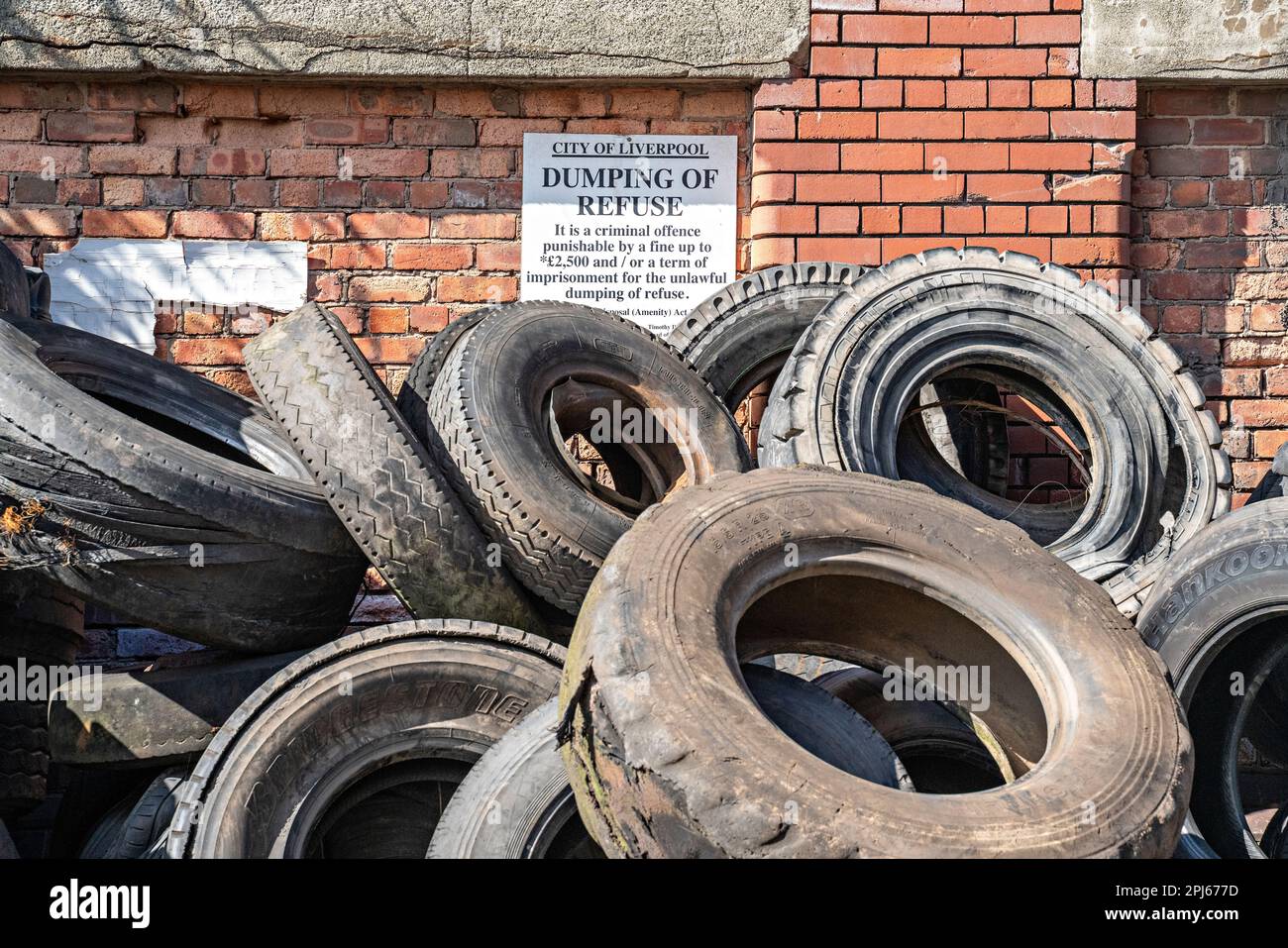 Pile of end-of-use truck tyres Stock Photo