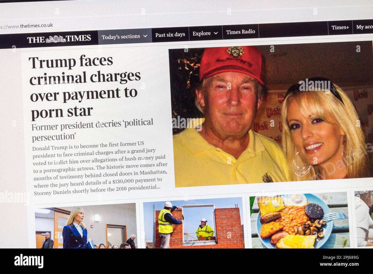 Headlines on The Times newspaper website with breaking news of the indictment of Fmr President Donald Trump, 31st March 2023. Stock Photo
