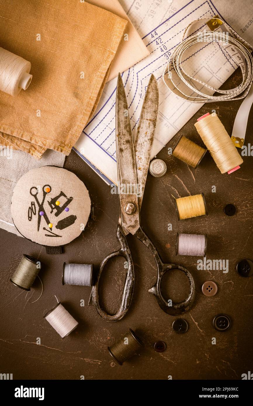 Sewing and craft tools old scissors, bobbins with thread and needles
