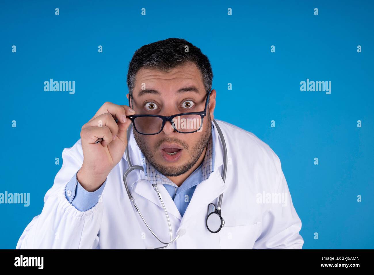 close up doctor with surprised expression wearing glasses on isolated