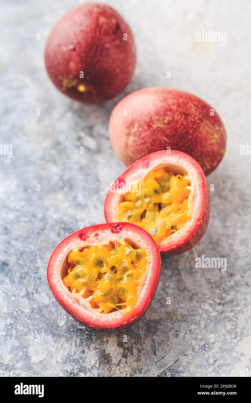 Organic raw passion fruit on kitchen table Stock Photo