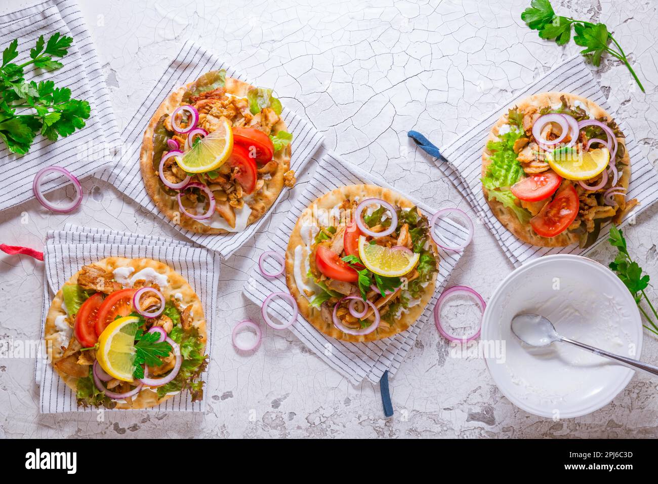 Greek gyros meat with pita flat bread, vegetables and onions and