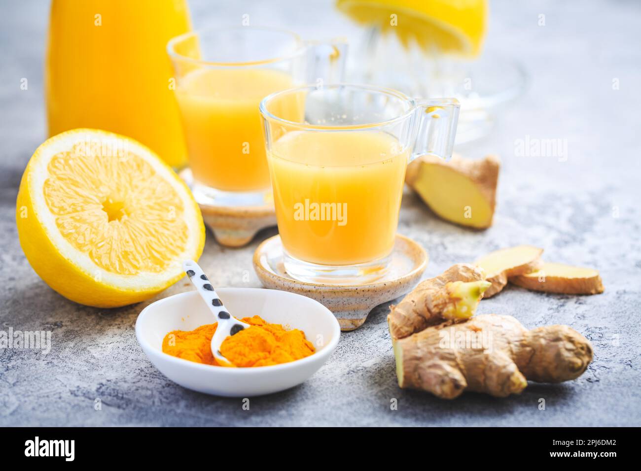Close up of healthy Ginger Lemon Turmeric Shot ? ideal to boost the