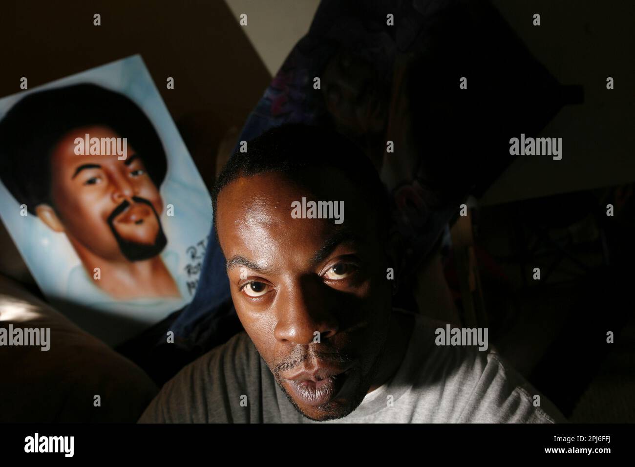 allen 028 ls.jpg Ron Allen Jr. (foreground) and artwork he made of his ...