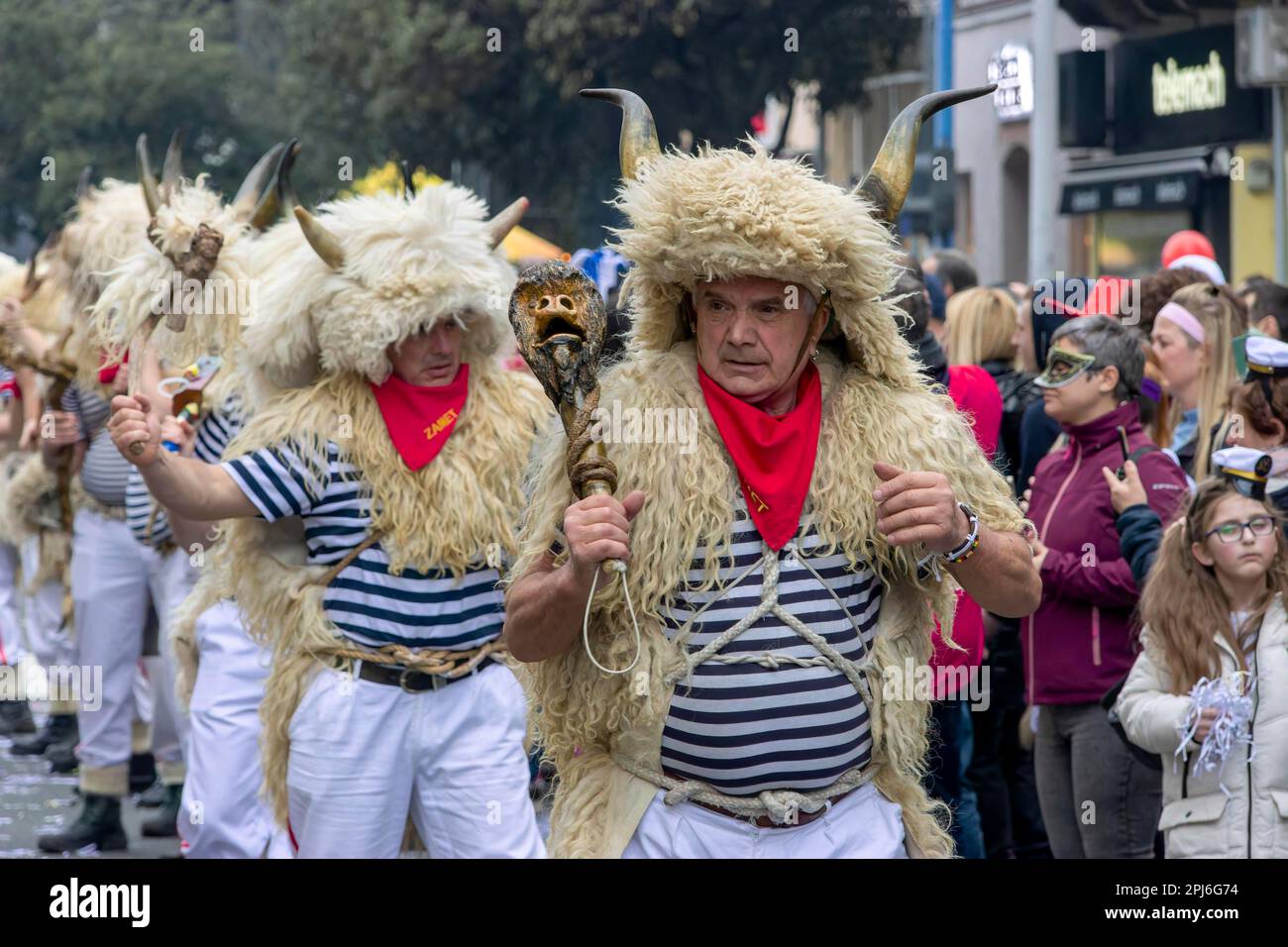 Traditional bell ringer masks in sailors mother, sheepskin and cap with  horns and sheepskin at the carnival in Rijeka, Croatia Stock Photo - Alamy