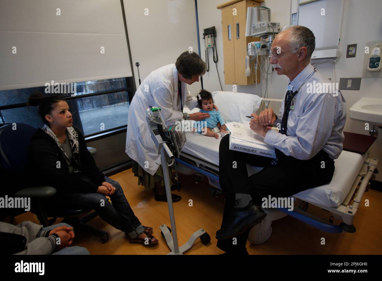 Elena Bojorquez (left) talks with Dr. Mort Cowan (right) at UCSF Benioff  Childrens Hospital on Wednesday, March 16, 2011 in San Francisco, Calif.  while Dr. Jennifer Puck (second from left) checks on