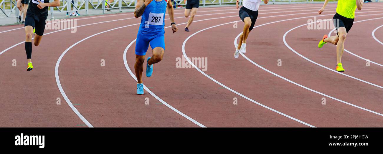 group male runners running track of stadium sprint race, athletics