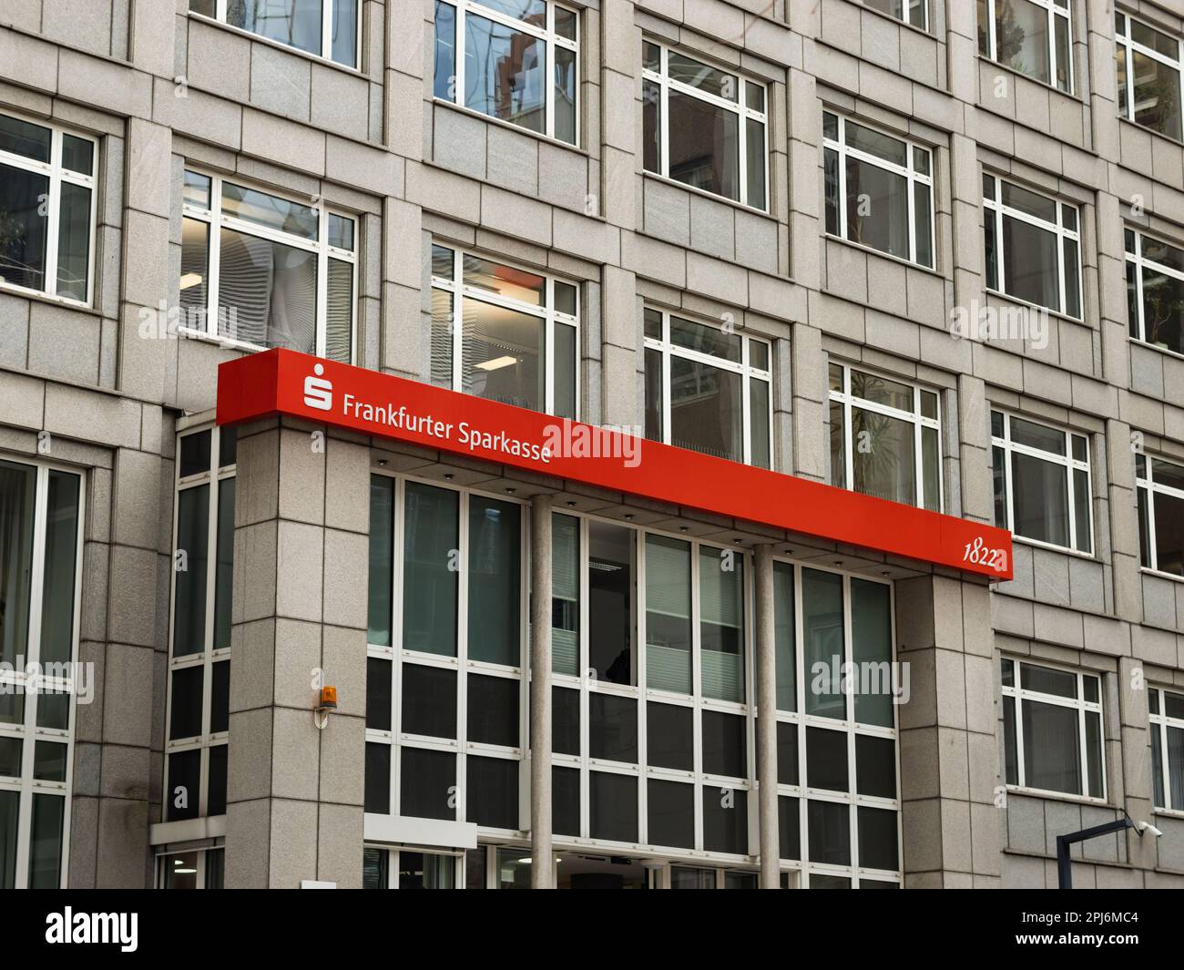 Entrance of the Frankfurter Sparkasse. Building exterior of the big German savings bank. The logo sign and the color is part of the corporate identity Stock Photo