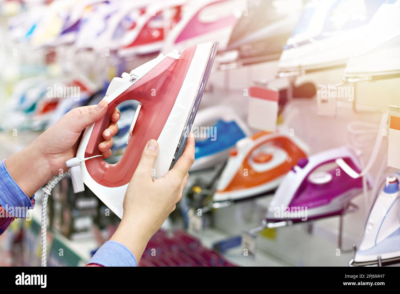 Buyer shopping for iron in store Stock Photo