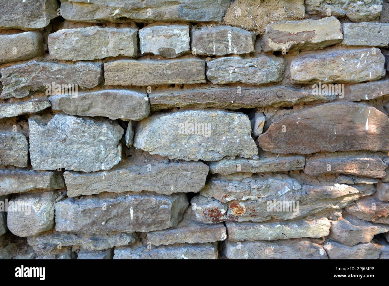 Old wall built of natural stone tiles Stock Photo Alamy