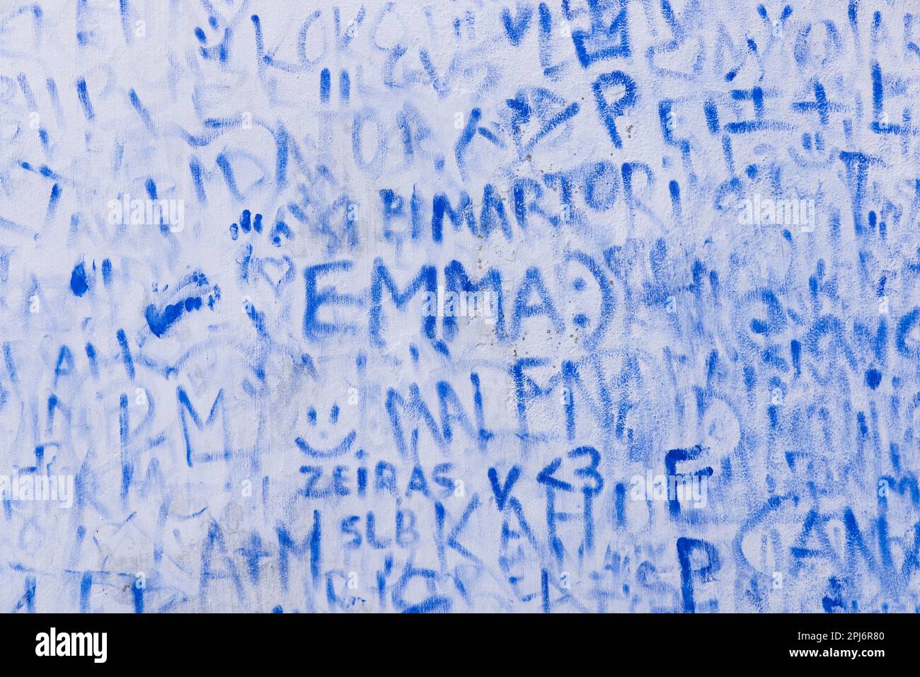 Europe, Portugal, Obidos. April 15, 2022. Blue graffiti names on a wall in Obidos. Stock Photo