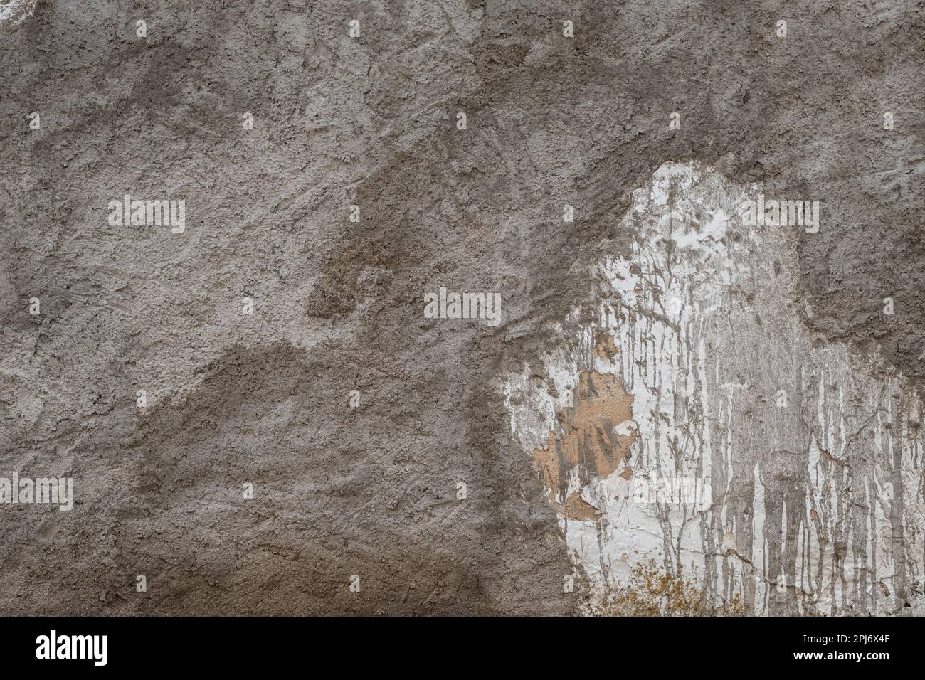 Cement render plaster coating on old white lime washed wall Stock Photo