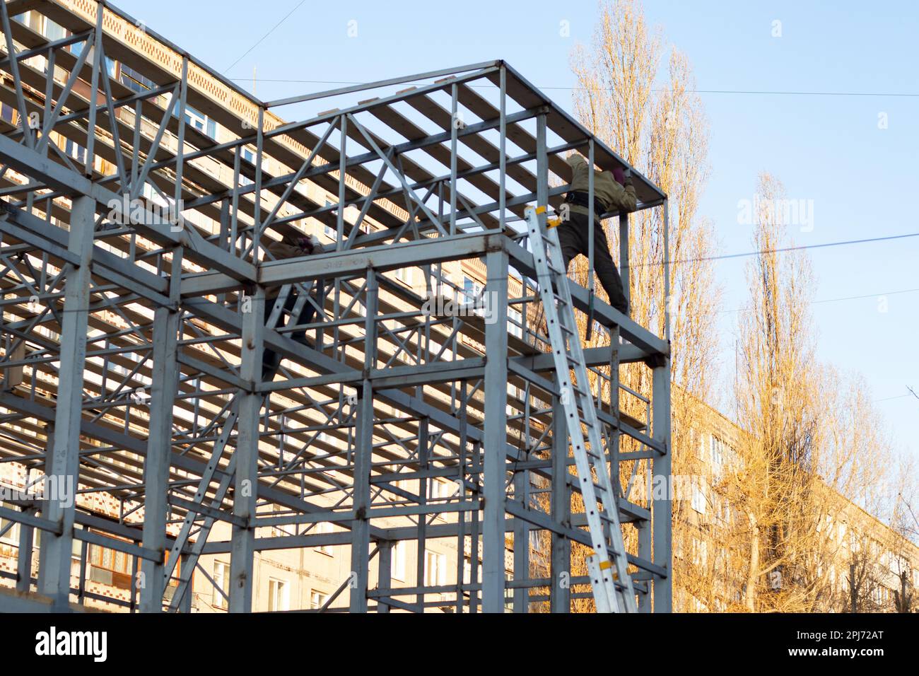 frame of metal profiles, building construction in the city Stock Photo