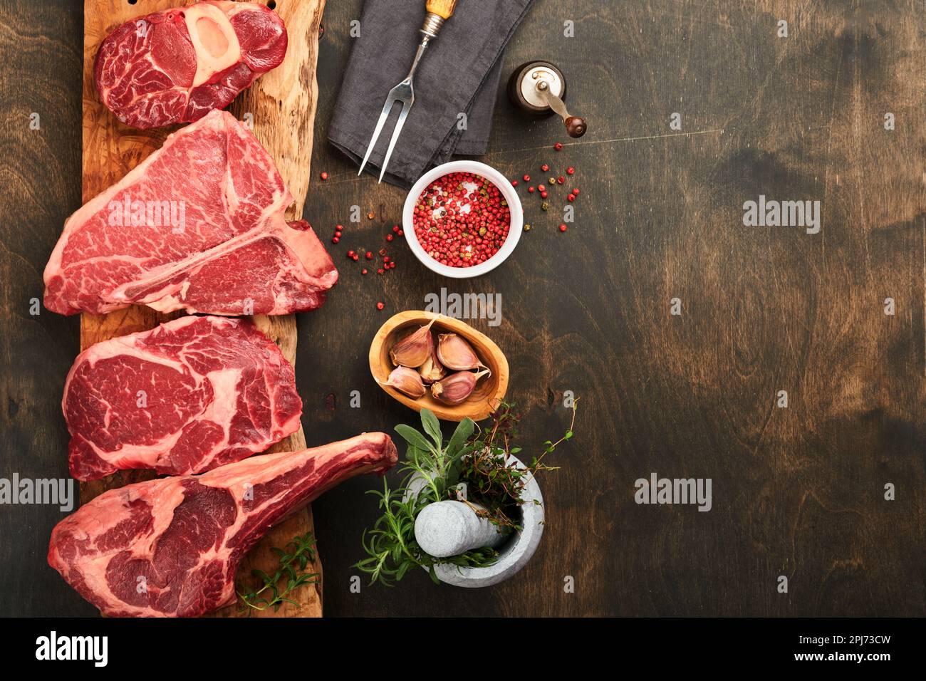 Raw prime steaks. Variety of fresh black angus prime meat steaks Tbone