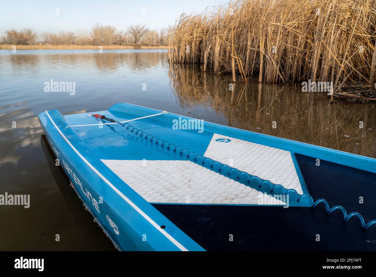Fort Collins, CO, USA - March 30, 2023: Tail of a touring stand up paddleboard designed for flatwater (2023 Waterline model by Starboard) on a lake sh Stock Photo