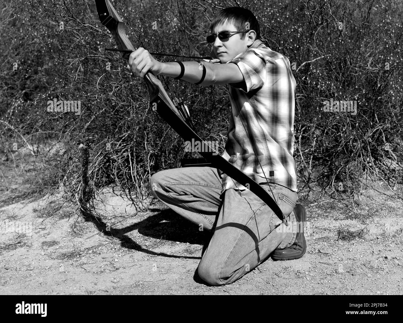 Young archer shooting a traditional recurve bow Stock Photo Alamy