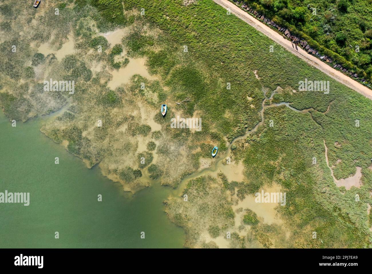 An aerial view of a coastal area with boats in the water Stock Photo ...