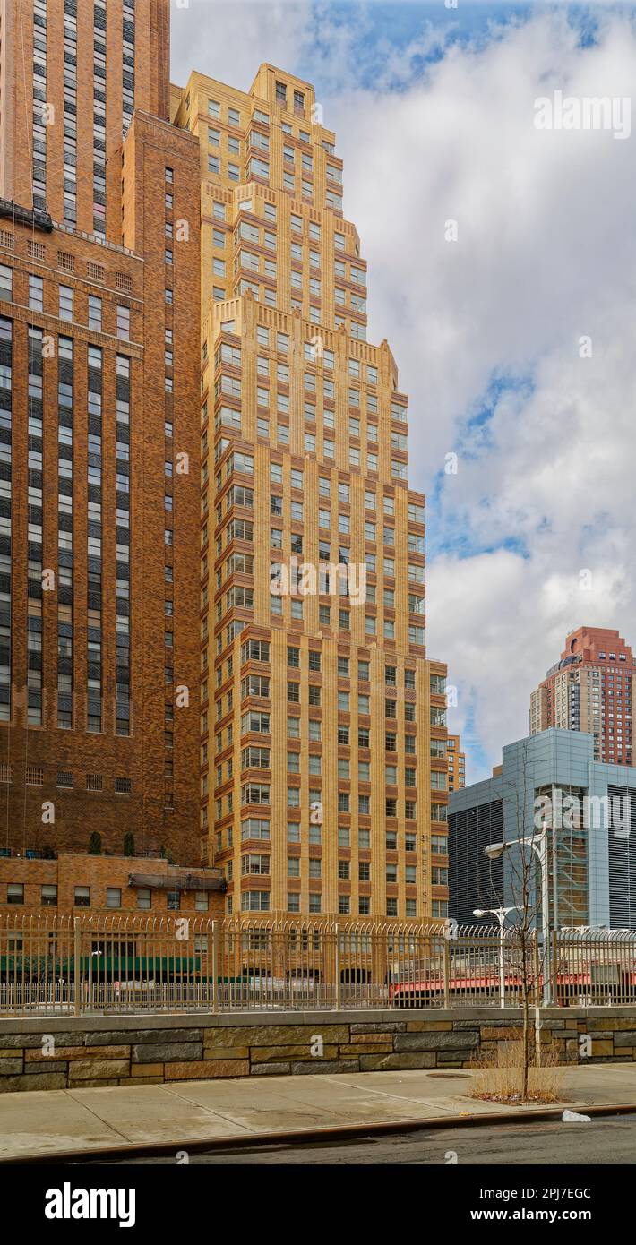 NYC Financial District: 20 and 21 West Street, adjacent brick apartment towers, were designed by Starrett & Van Vleck for different purposes. Stock Photo