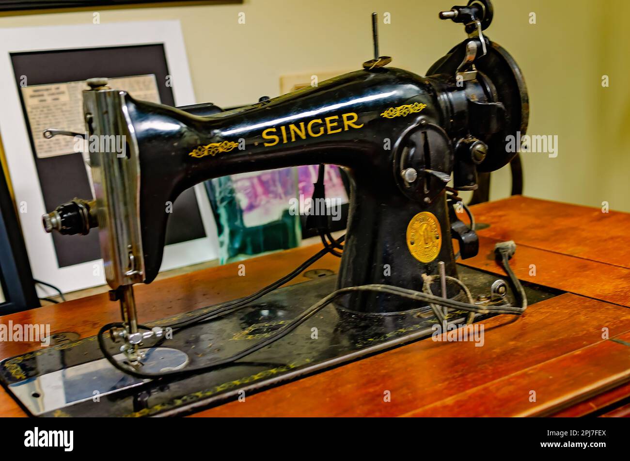 A vintage Singer sewing machine is displayed at Old Firehouse Museum, March 29, 2023, in Wiggins, Mississippi. Stock Photo
