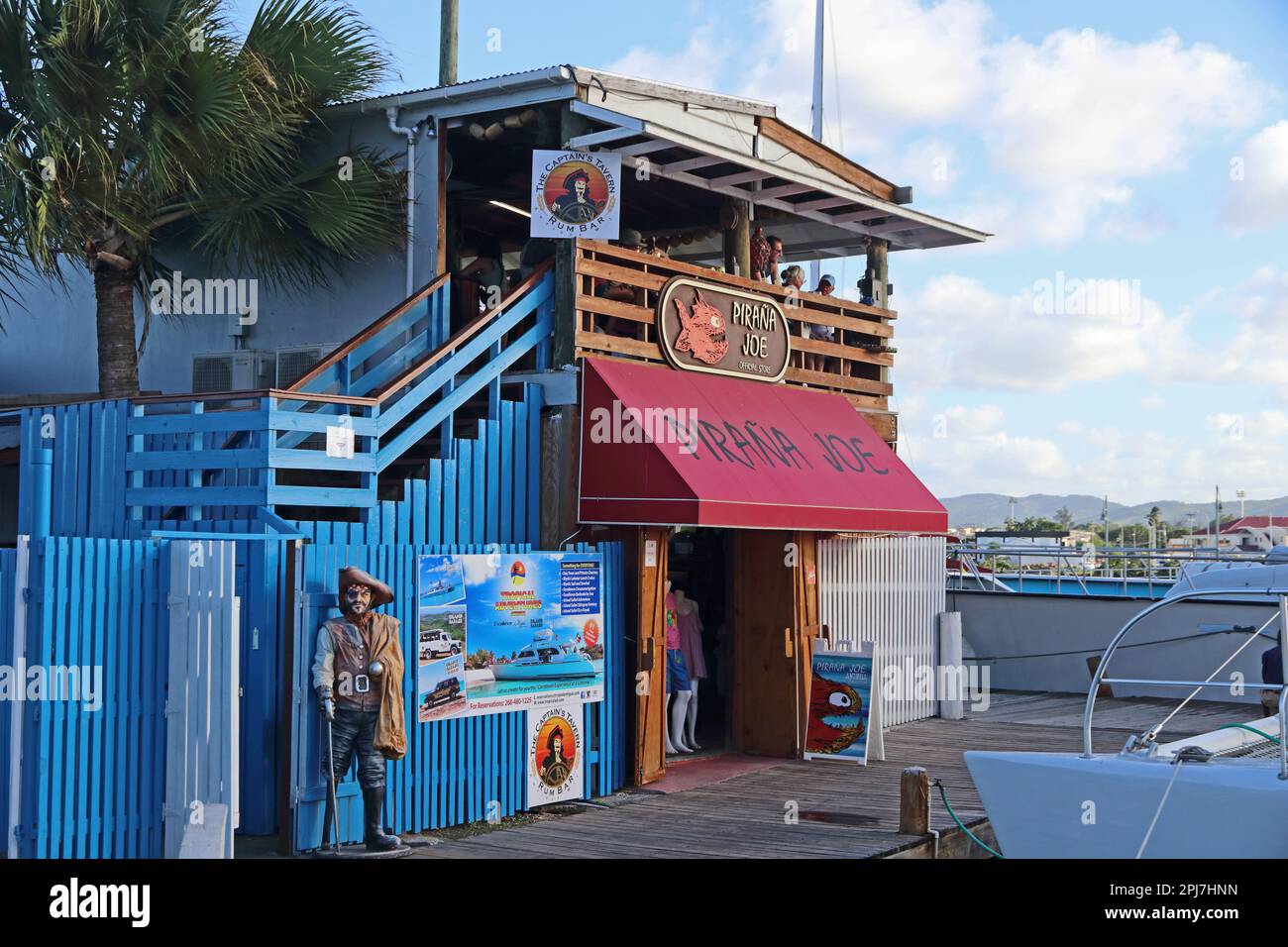 Pirana Joe store and The Captain's Tavern, in port of St Johns, Antigua