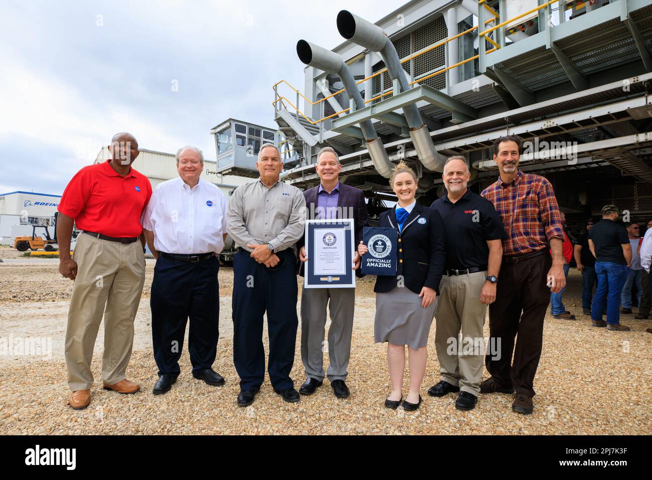 KSC, Florida, USA. 29th Mar, 2023. Guinness World Records officially designated NASA's Crawler Transporter 2 as the heaviest self-powered vehicle, weighing approximately 6.65 million pounds. During a March 29, 2023, ceremony at the agency's Kennedy Space Center in Florida, Guinness World Records presented a certificate to teams with the Exploration Ground Systems Program and Kennedy leadership. Pictured, from left, are: Kelvin Manning, Kennedy deputy director; Burt Summerfield, Kennedy associate director, management; Brett Raulerson, Jacobs TOSC Crawlers, Transporters and Structures group ma Stock Photo