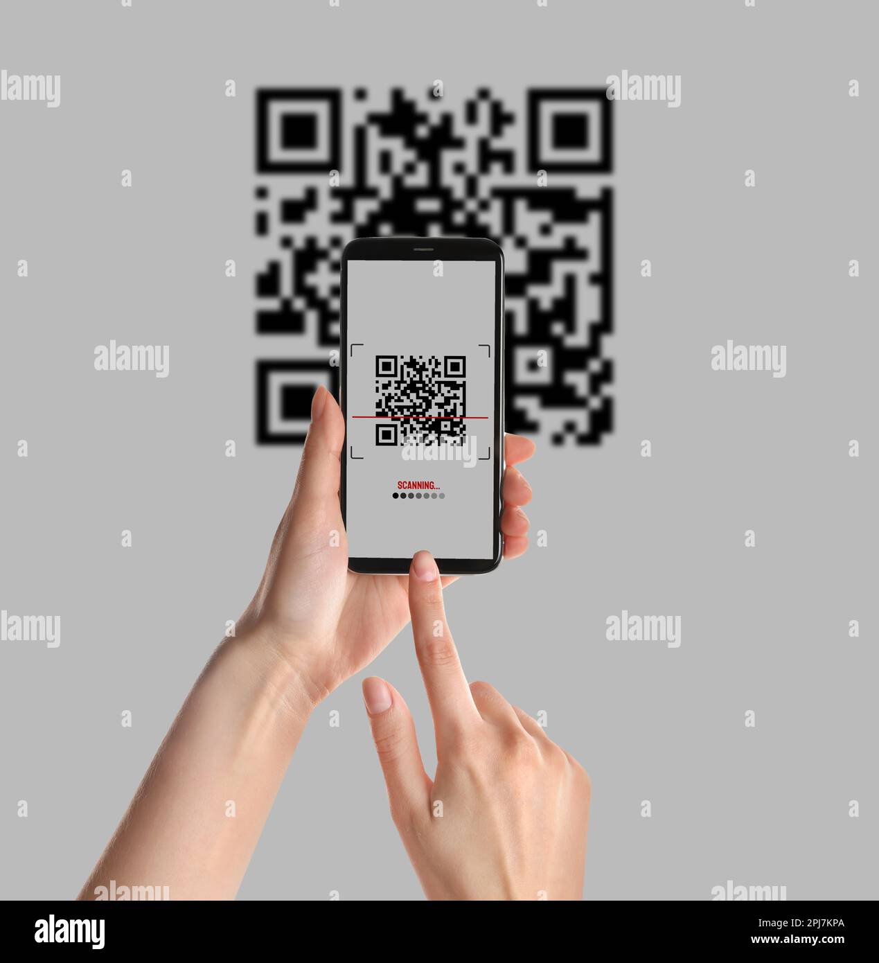 Woman scanning QR code with smartphone on light background, closeup ...
