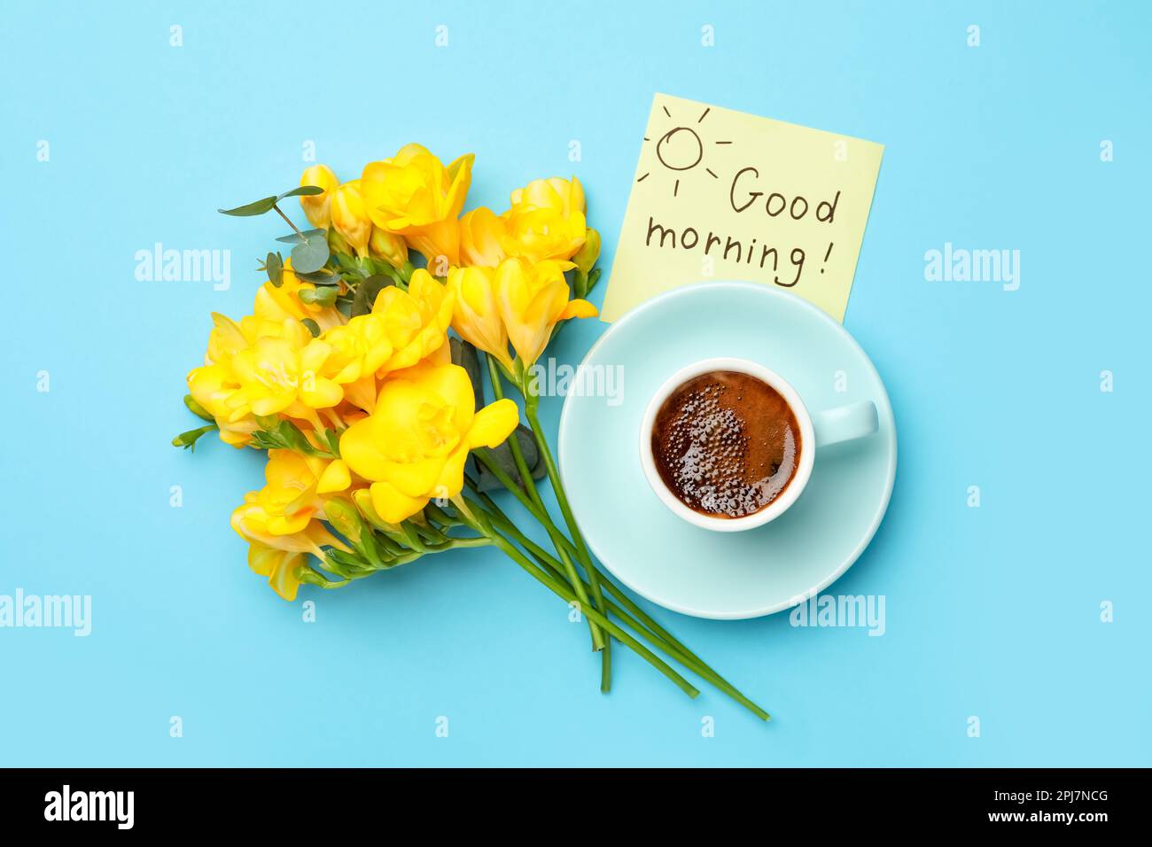 Cup of aromatic coffee, beautiful yellow freesias and Good Morning note ...