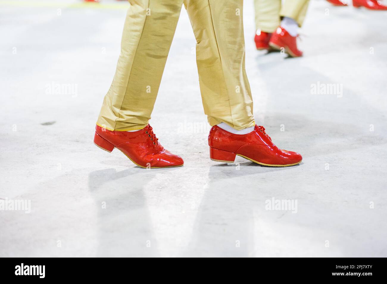 samba dancer with sand colored pants and red shoes performing in Rio de Janeiro, Brazil. Stock Photo