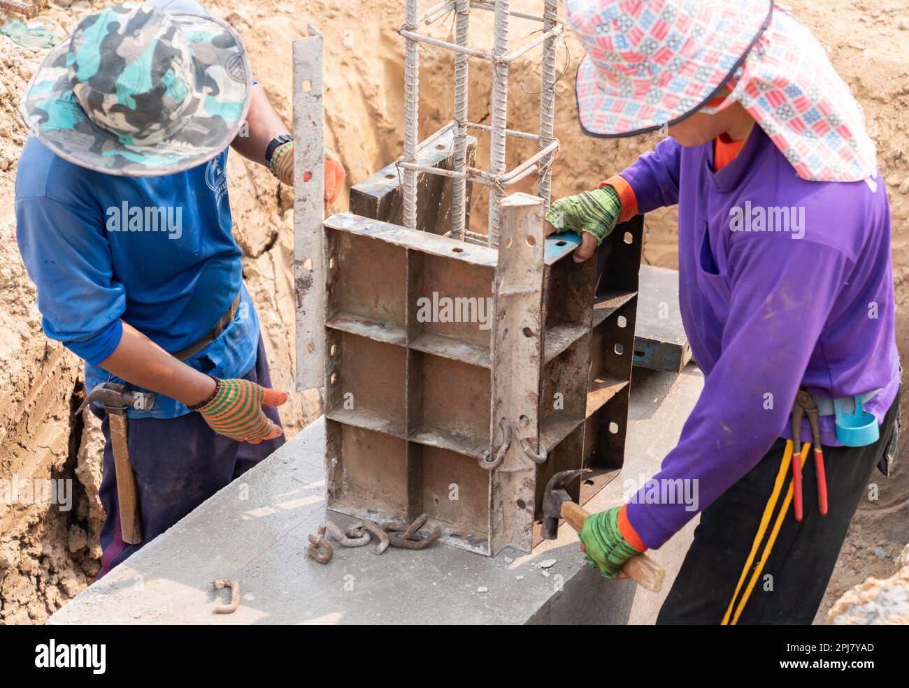 Workers assembly and water level gauge in foudation of construction site Stock Photo Alamy