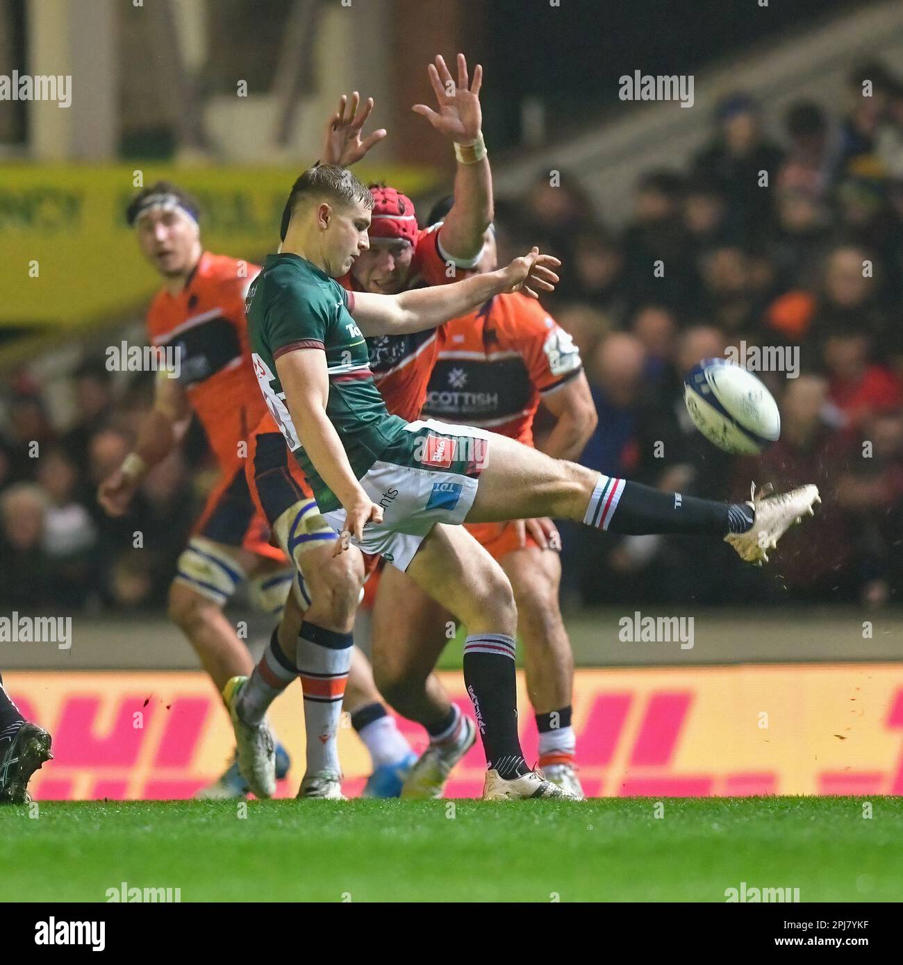 Leicester Tigers Rugby v Edinburgh Rugby Team at the Mattioli Stadium in Leicester, UK on 31 March 2023.  Jack Van Poortvliet (Leicester Tigers) kicks the ball avoiding block from Edinburgh player at the Mattioli Rugby Stadium, Leicester, Uk  Credit: Mark Dunn/Alamy Live News Stock Photo
