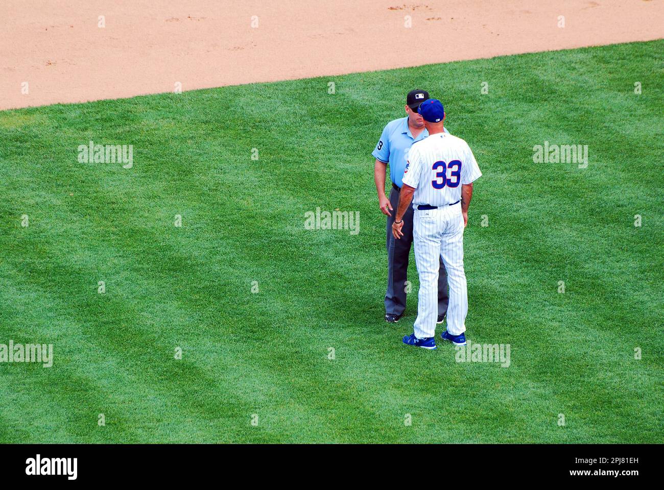 A baseball manager for the Chicago Cubs argues a call with an umpire