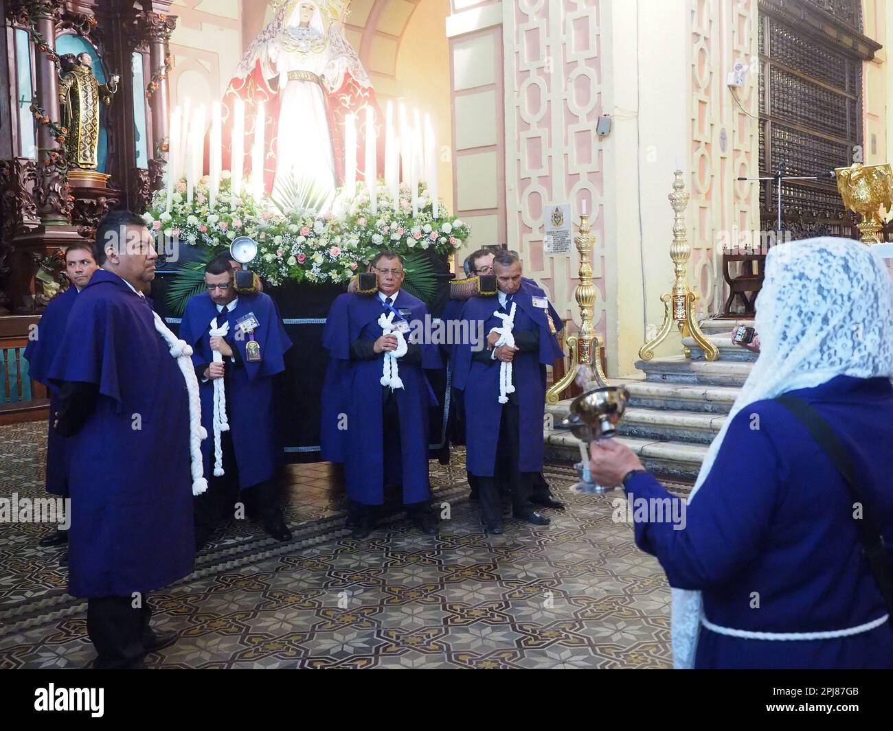 Devotees carrying a religious image leading the Friday of Sorrows ...