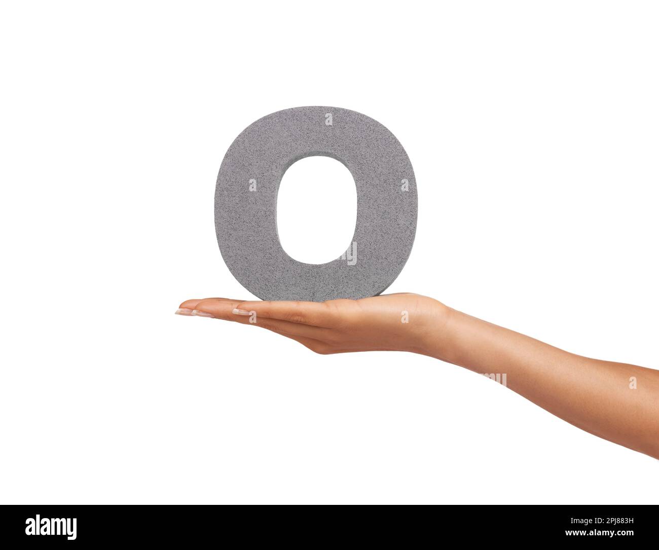Showing you the letter O. A young woman holding a capital letter O isolated on a white background. Stock Photo