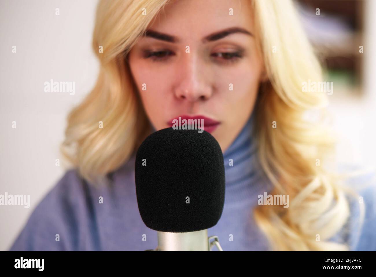 Young Woman Recording ASMR Sounds On Microphone Stock Photo Alamy