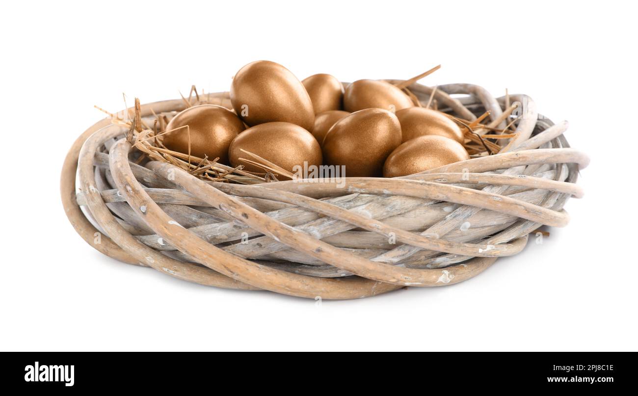 Many golden eggs in nest on white background Stock Photo - Alamy