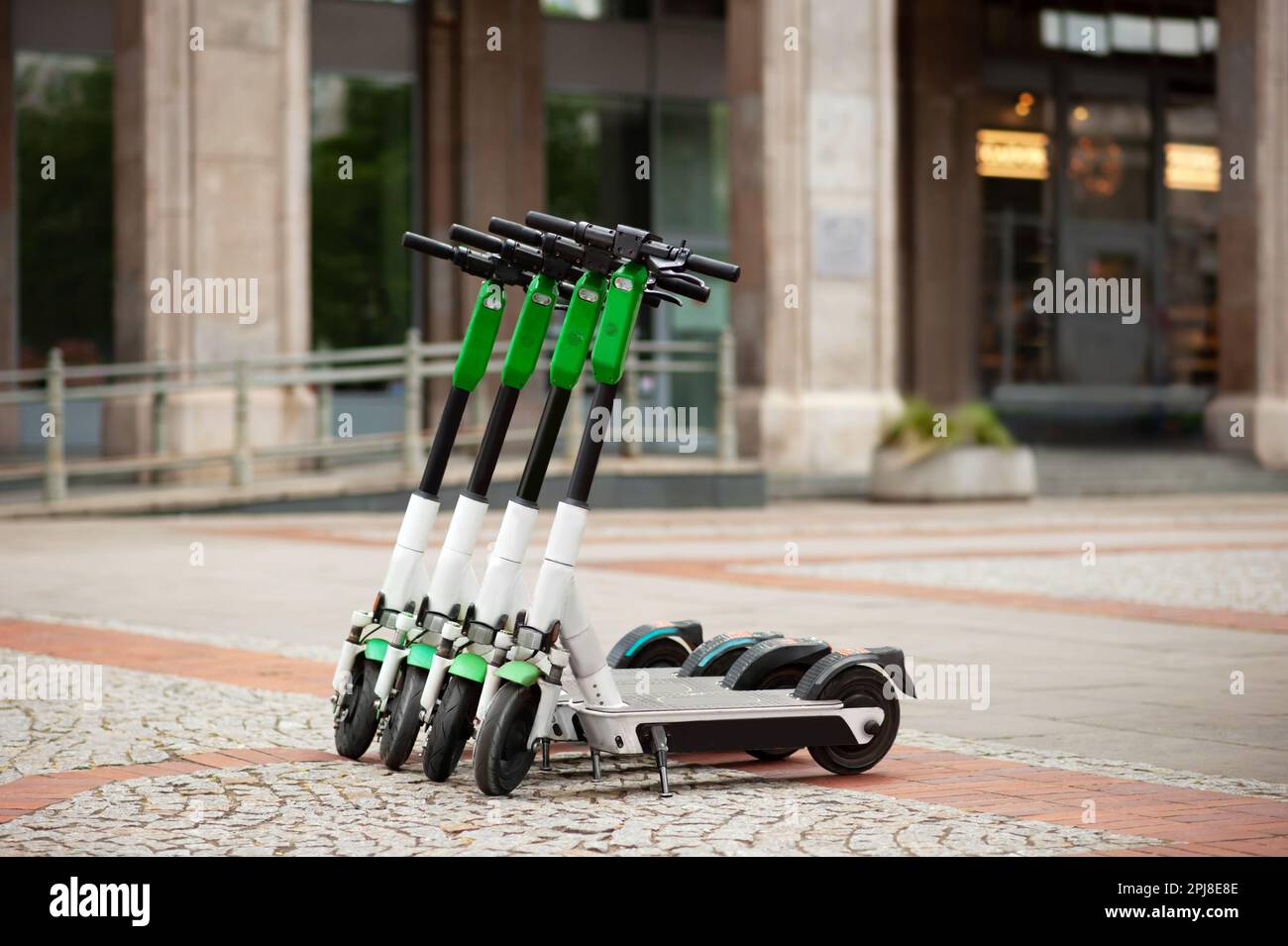Scooter Rent Building Row of electric scooters on city street. Rental service Stock Photo - Alamy